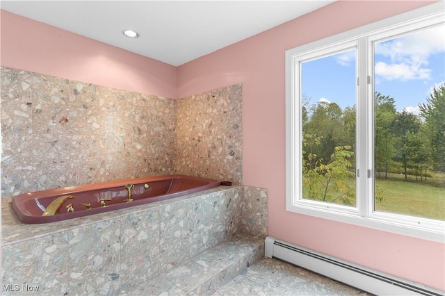 bathroom with a baseboard radiator and a washtub