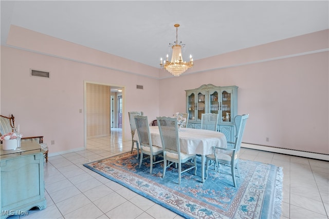 tiled dining area featuring an inviting chandelier and a baseboard heating unit