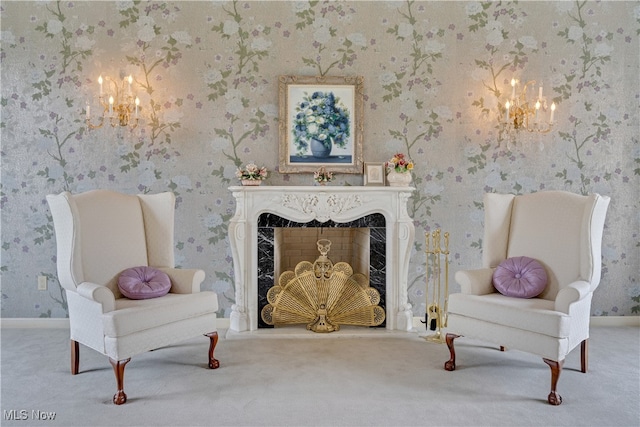 sitting room with carpet, an inviting chandelier, and a high end fireplace