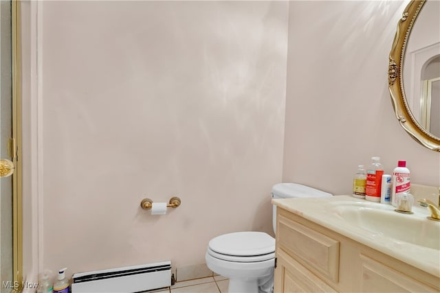 bathroom featuring tile patterned flooring, vanity, toilet, and a baseboard radiator