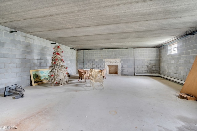 basement featuring a baseboard heating unit