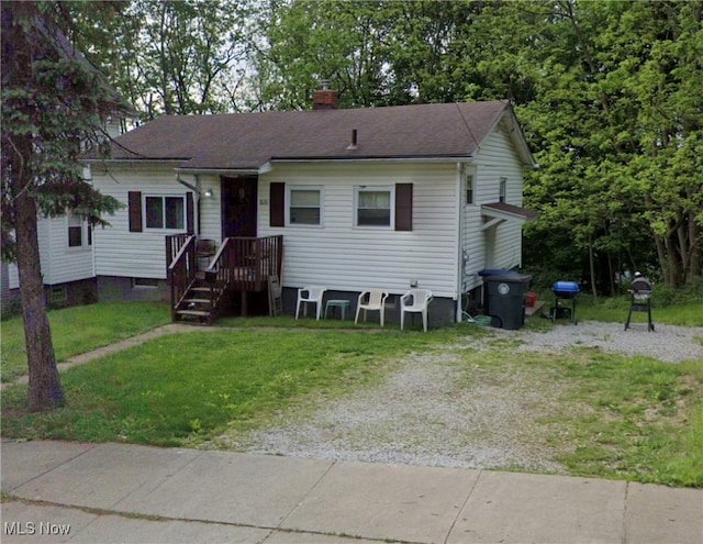 view of front of home with a front yard