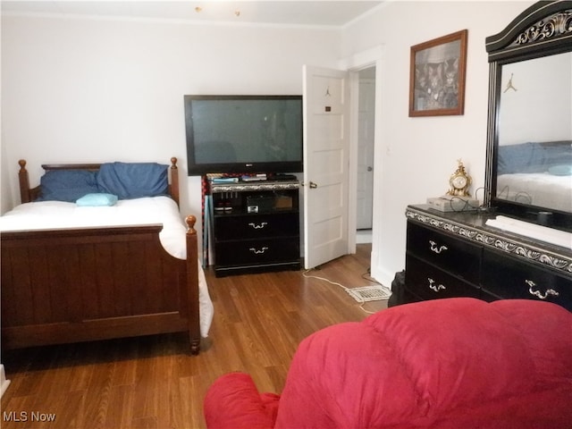 bedroom featuring hardwood / wood-style flooring