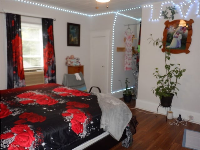 bedroom featuring dark wood-type flooring