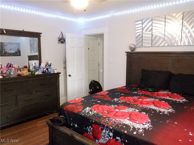 bedroom with hardwood / wood-style floors