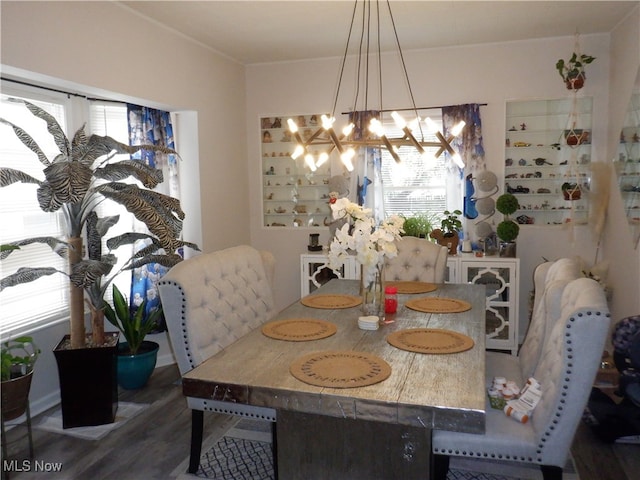 dining area with a notable chandelier and wood-type flooring