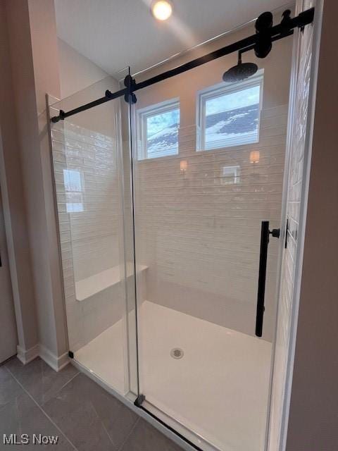 bathroom featuring tile patterned flooring and walk in shower