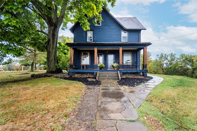 view of front of property with a front lawn and a porch