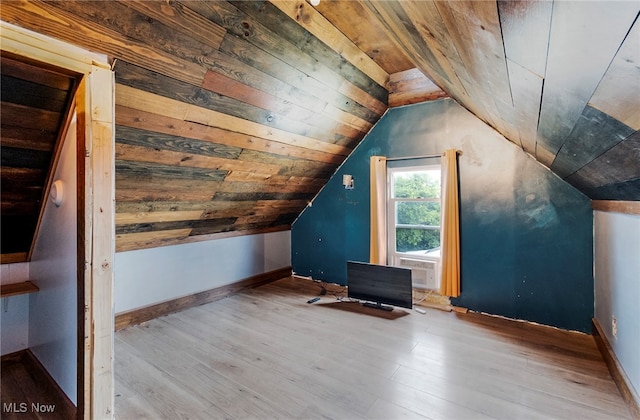 additional living space featuring wood ceiling, vaulted ceiling, and light hardwood / wood-style floors