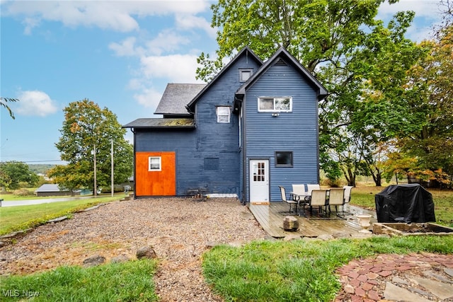 rear view of property with a patio area