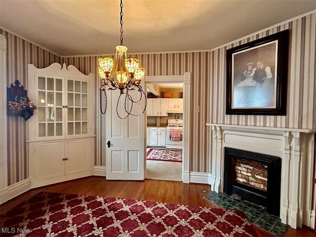 interior space with a chandelier and hardwood / wood-style flooring