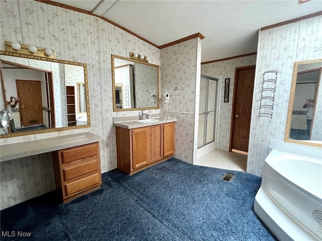 bathroom with independent shower and bath, vanity, lofted ceiling, and crown molding