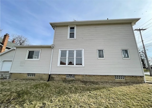 rear view of house with a lawn