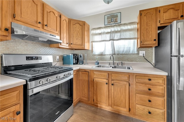 kitchen with stainless steel appliances, backsplash, and sink