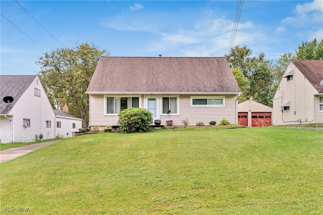 view of front of property with a front yard and a garage