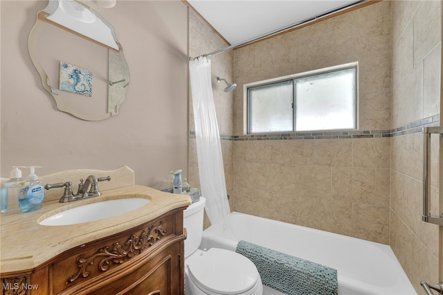 full bathroom featuring vanity, toilet, and shower / bath combination with curtain