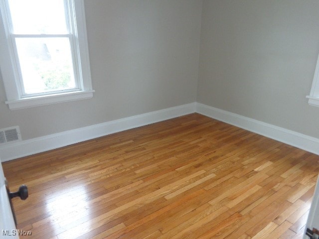 spare room with light hardwood / wood-style floors