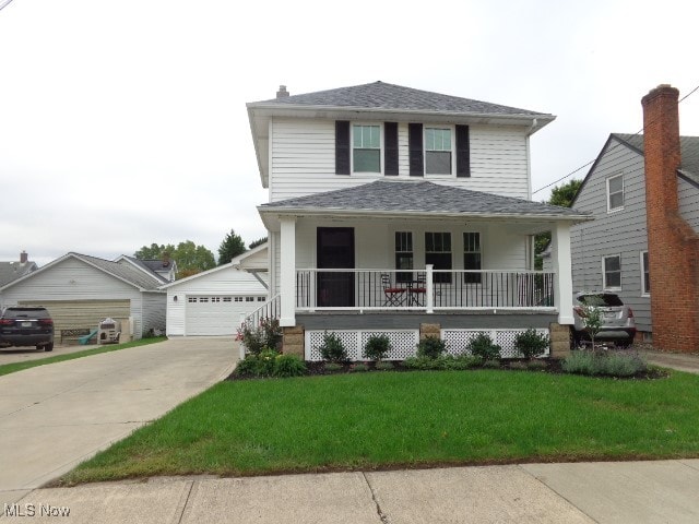 view of front of home featuring a garage, a front lawn, and covered porch