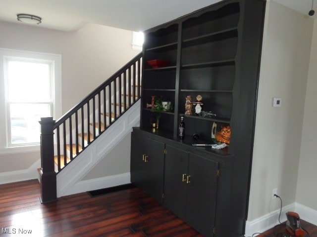 stairway with hardwood / wood-style flooring