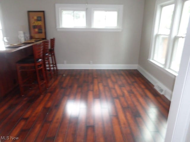 dining area featuring dark hardwood / wood-style flooring