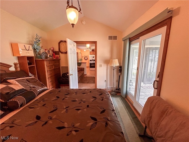 bedroom featuring access to outside and lofted ceiling