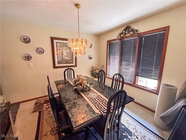 carpeted dining area featuring a textured ceiling and an inviting chandelier