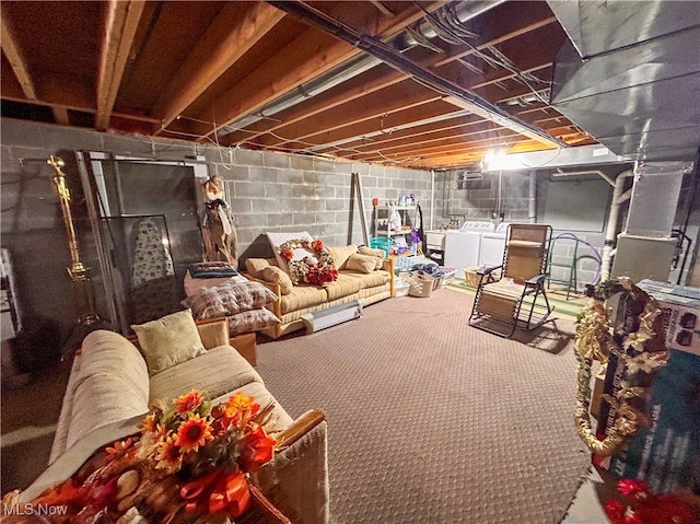 basement featuring independent washer and dryer and carpet floors