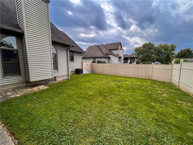 view of yard with central AC