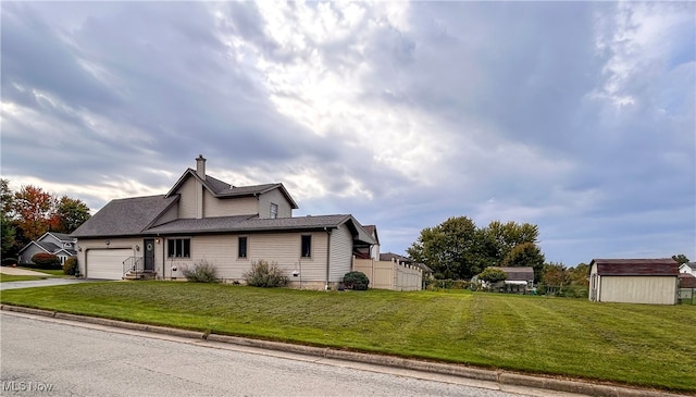 view of property exterior with a yard and a garage