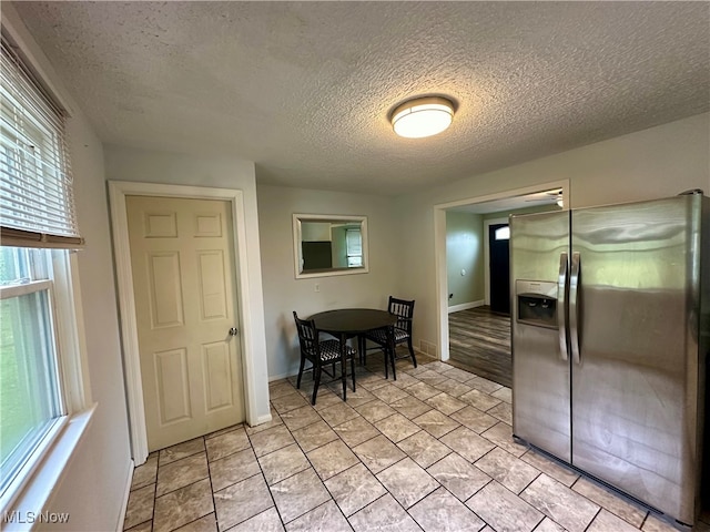 dining area with a textured ceiling