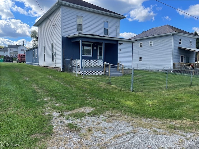 view of front of property with a front yard and covered porch