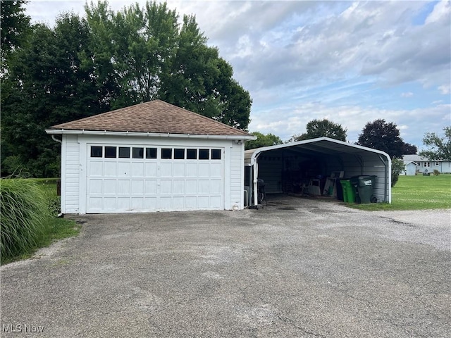 garage featuring a carport