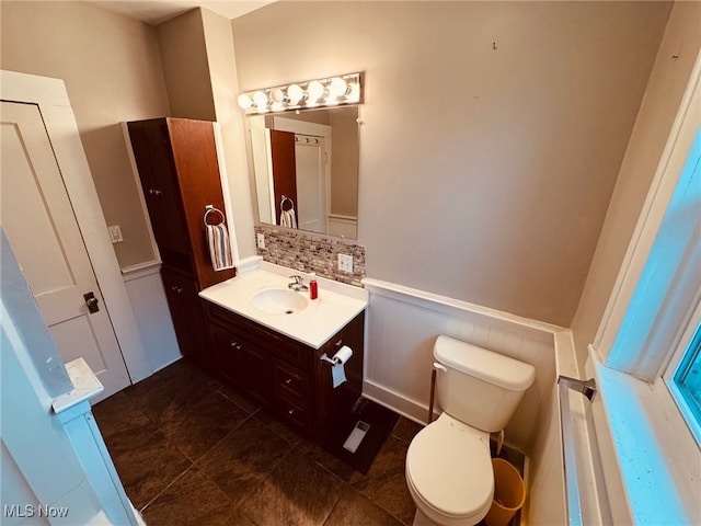 bathroom featuring tile patterned floors, vanity, and toilet