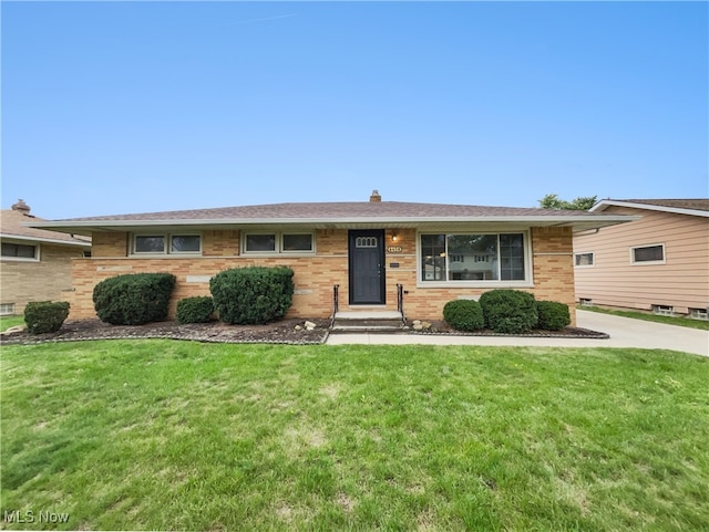 ranch-style house with a front lawn