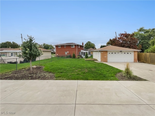 view of front of house featuring a garage and a front yard