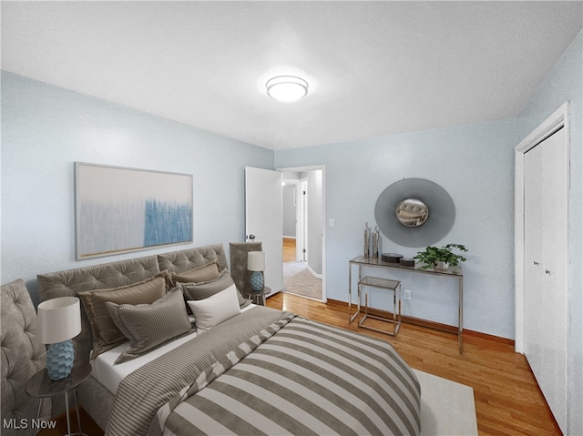 bedroom with light hardwood / wood-style floors