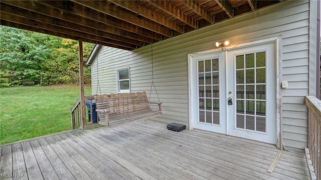 wooden deck with a lawn