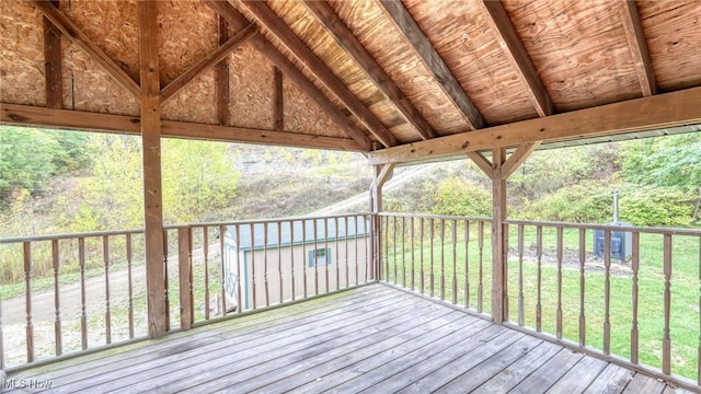 wooden deck with a lawn