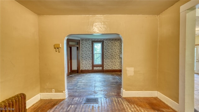 spare room featuring hardwood / wood-style flooring