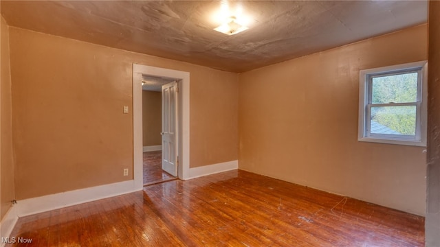 unfurnished room featuring wood-type flooring