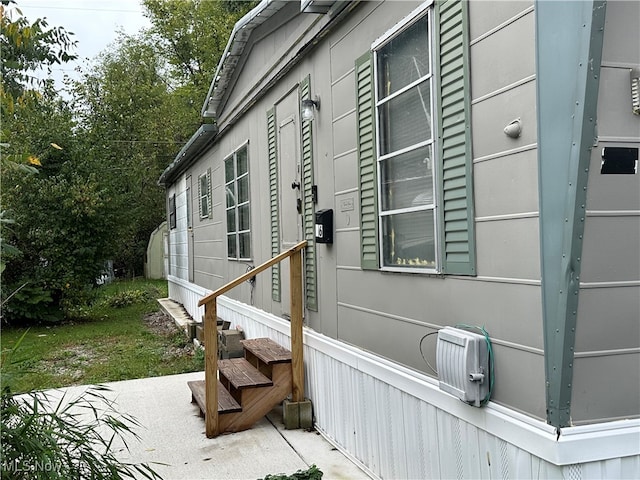 view of side of property featuring a patio