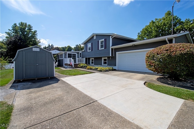 split level home featuring a shed and a garage