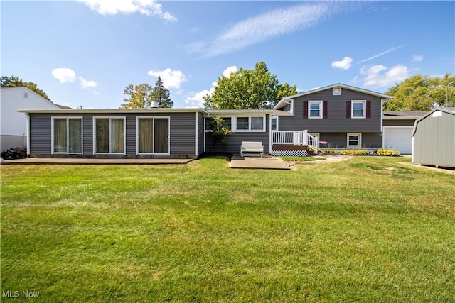 back of property featuring a storage shed, a lawn, and a patio area