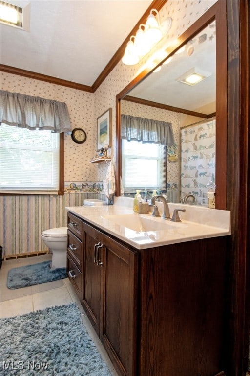 bathroom with vanity, tile patterned flooring, toilet, and crown molding