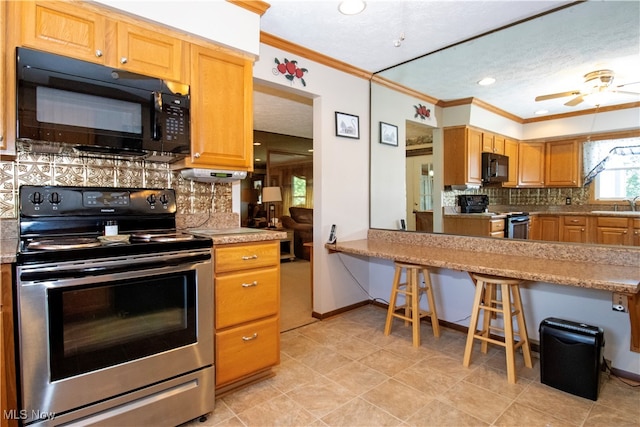 kitchen featuring ceiling fan, stainless steel electric stove, backsplash, and crown molding