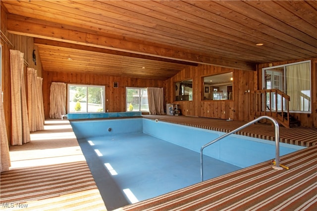 view of swimming pool featuring a hot tub