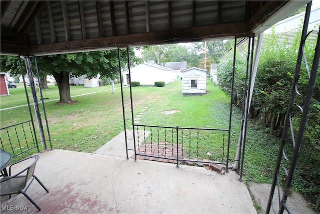 view of patio / terrace featuring a shed