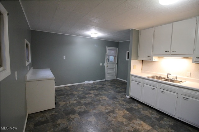 kitchen with sink and white cabinetry