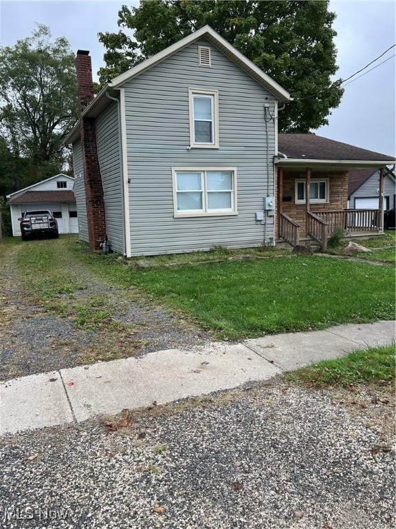 view of front of property with a garage and covered porch