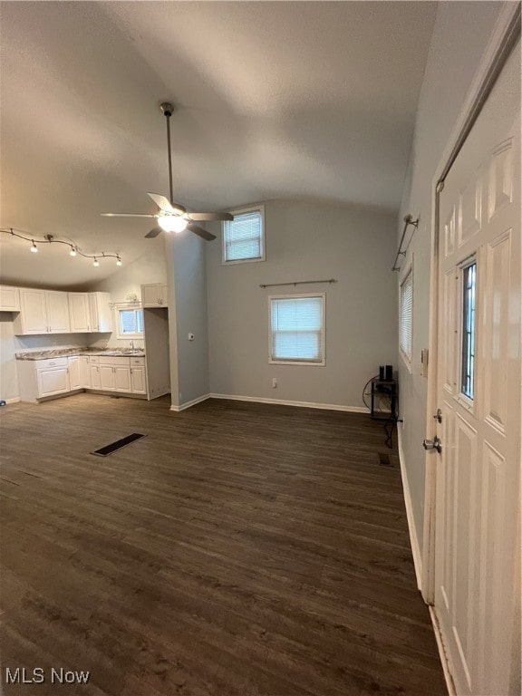 unfurnished living room featuring high vaulted ceiling, ceiling fan, and dark hardwood / wood-style flooring